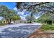 Neighborhood street view showcasing a manicured streetscape with lush trees and well-maintained homes at 16501 Sandhill Crane Dr, Spring Hill, FL 34610