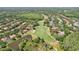 Aerial view showcases the community's golf course, ponds, and surrounding residential homes at 17712 Long Ridge Rd, Tampa, FL 33647