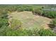 Aerial view of a lush community soccer field and neighborhood with surrounding trees and landscaping at 17712 Long Ridge Rd, Tampa, FL 33647