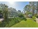 Enjoy the serene backyard oasis with a screened-in pool and lush landscaping at 17712 Long Ridge Rd, Tampa, FL 33647