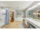 Bright bathroom with double vanities, walk-in closet, tub, and separate shower at 17712 Long Ridge Rd, Tampa, FL 33647