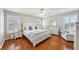 Charming bedroom with hardwood floors, plantation shutters, ceiling fan, and stylish decor at 17712 Long Ridge Rd, Tampa, FL 33647