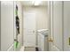 Functional laundry room with a modern washer and dryer, plus ample storage space at 17712 Long Ridge Rd, Tampa, FL 33647