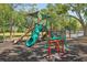 Community playground featuring a slide, jungle gym and other play equipment at 17712 Long Ridge Rd, Tampa, FL 33647