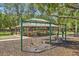Community playground featuring swings and picnic tables, perfect for Gathering gatherings at 17712 Long Ridge Rd, Tampa, FL 33647