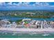 Expansive aerial view of the beach, ocean, and the community at 19451 Gulf Blvd # 506, Indian Shores, FL 33785