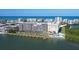 Waterfront condo complex with amenities including a pool and boat docks, offering a relaxed and convenient coastal lifestyle at 19451 Gulf Blvd # 506, Indian Shores, FL 33785