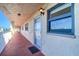 Condo exterior featuring a walkway with views and a bright exterior light fixture at 19451 Gulf Blvd # 506, Indian Shores, FL 33785
