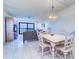 Bright and airy living room featuring tile floors and a great view at 19451 Gulf Blvd # 506, Indian Shores, FL 33785