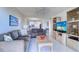 Comfortable living room featuring tile flooring, ceiling fan, and plenty of natural light at 19451 Gulf Blvd # 506, Indian Shores, FL 33785
