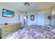 Spacious main bedroom featuring bright paint, ceiling fan, and water view at 19451 Gulf Blvd # 506, Indian Shores, FL 33785