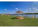 Outdoor picnic area with tables offers a serene setting with views of the water at 19451 Gulf Blvd # 506, Indian Shores, FL 33785
