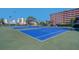 Brightly colored tennis courts ready for a match at 19451 Gulf Blvd # 506, Indian Shores, FL 33785