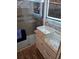 Bathroom featuring updated sink, granite countertop, and glass-enclosed shower at 2043 Ketch Cir, Palm Harbor, FL 34683