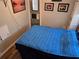 Bedroom with bed and storage; decorated with wall art at 2043 Ketch Cir, Palm Harbor, FL 34683