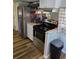 Efficient kitchen layout with stainless steel appliances and granite countertops at 2043 Ketch Cir, Palm Harbor, FL 34683