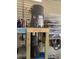 A Rheem water heater is mounted over a shop-vac in this utility space at 2043 Ketch Cir, Palm Harbor, FL 34683