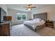 Comfortable bedroom featuring a cozy bed, soft carpet, and a window with natural light at 20472 Monza Loop, Land O Lakes, FL 34638