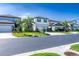 Charming street view showcasing well-maintained homes, manicured lawns, and lush landscaping at 20472 Monza Loop, Land O Lakes, FL 34638