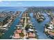Expansive aerial view of a waterfront community with canals, docks, and luxury homes nestled along the Florida coast at 2057 Kansas Ne Ave, St Petersburg, FL 33703