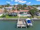 Aerial view showcasing the home, private pool, boat dock, and waterfront location at 2057 Kansas Ne Ave, St Petersburg, FL 33703
