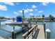 Private boat dock with lift, providing direct access to the waterfront at 2057 Kansas Ne Ave, St Petersburg, FL 33703