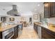 Gourmet kitchen features granite countertops, stainless steel appliances, and a center island with seating at 2057 Kansas Ne Ave, St Petersburg, FL 33703
