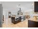 Gourmet kitchen features granite countertops, stainless steel appliances, and a center island with seating at 2057 Kansas Ne Ave, St Petersburg, FL 33703