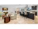 Open-concept kitchen features a large island, stainless steel appliances, and access to the living area at 2057 Kansas Ne Ave, St Petersburg, FL 33703