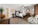 Relaxing main bedroom with dark wood furniture and a view into the main bathroom at 2057 Kansas Ne Ave, St Petersburg, FL 33703