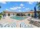 Relaxing backyard pool with lounge furniture and seamless access to the home's interior at 2057 Kansas Ne Ave, St Petersburg, FL 33703