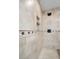 Detailed tile work in the stand up shower with built-in shelves at 2057 Kansas Ne Ave, St Petersburg, FL 33703