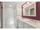 Bathroom with double vanity, framed mirror, and walk-in shower at 2141 Brent Pl, Palm Harbor, FL 34683