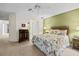 Comfortable bedroom with adjacent closet and ceiling fan provides a relaxing retreat at 235 Woodridge Cir, Oldsmar, FL 34677