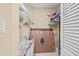 Organized walk-in closet featuring shelving, hanging racks, and space for storage containers at 235 Woodridge Cir, Oldsmar, FL 34677
