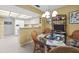 Bright dining space with cozy chairs, adjacent to the kitchen, creating a seamless transition at 235 Woodridge Cir, Oldsmar, FL 34677