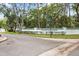 Community entrance featuring signage, decorative landscaping, and a welcoming atmosphere at 235 Woodridge Cir, Oldsmar, FL 34677