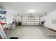 Spacious two-car garage with ample storage and shelving, offering plenty of room for vehicles and organizing tools at 235 Woodridge Cir, Oldsmar, FL 34677