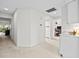 Bright hallway with neutral carpeting, leading to various rooms in the home at 235 Woodridge Cir, Oldsmar, FL 34677
