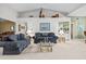 Open-concept living room featuring high ceilings and an adjoining dining area at 235 Woodridge Cir, Oldsmar, FL 34677