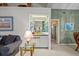 Relaxing living room area featuring a built-in bar for entertaining and comfortable seating at 235 Woodridge Cir, Oldsmar, FL 34677