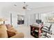 Well-lit office space offering comfortable seating, desk space, and seamless access to the rest of the house at 235 Woodridge Cir, Oldsmar, FL 34677
