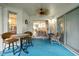 Covered patio, perfect for outdoor lounging, features tile flooring and comfortable seating arrangements at 235 Woodridge Cir, Oldsmar, FL 34677
