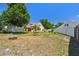 Generous backyard features a blend of mature trees and fencing, offering both shade and privacy at 24231 Satinwood Ct, Lutz, FL 33559