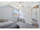 Small bedroom with a window, shelving, neutral walls, and carpeting at 24231 Satinwood Ct, Lutz, FL 33559