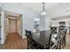 Spacious dining area with access to the kitchen and hallways, adjacent to a living area at 24231 Satinwood Ct, Lutz, FL 33559