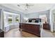 Main bedroom features a tray ceiling, a bay window and hardwood flooring at 24231 Satinwood Ct, Lutz, FL 33559