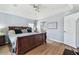 Spacious main bedroom with a ceiling fan, walk-in closet, and ensuite bathroom at 24231 Satinwood Ct, Lutz, FL 33559