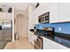 Well-equipped kitchen with stainless steel appliances, gas range, and ample cabinet space at 2875 Grazeland Dr, Sarasota, FL 34240