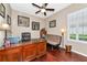 Dedicated home office space with hardwood floors, plantation shutters, and ample natural light at 2875 Grazeland Dr, Sarasota, FL 34240